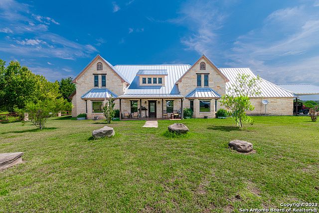 127.5 Acres, 4/3.5+ Limestone Home w/Pool & Outdoor Kitchen, 5600 sf Barn, Round Pen, Arena w/ Announcer & Concession Stands, Ag Exempt